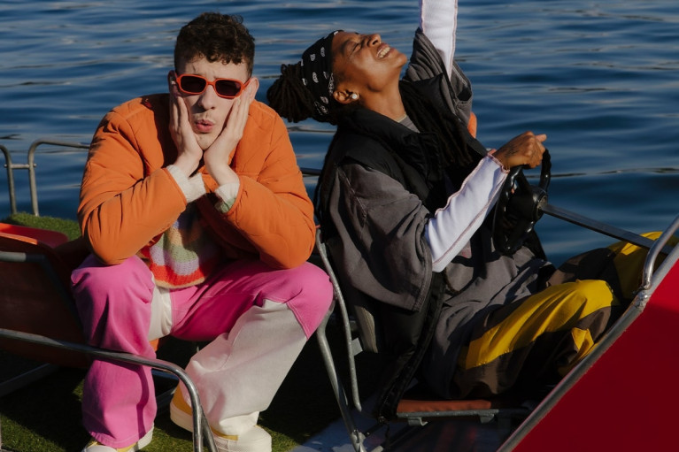 Nemo and KT Gorique on a boat in the sunshine