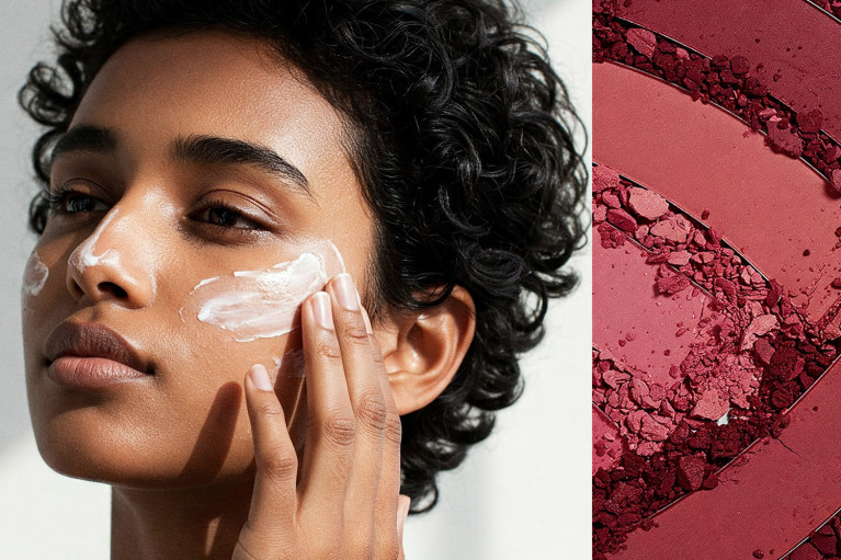 A person using face cream on their cheek and some red and pink make-up.