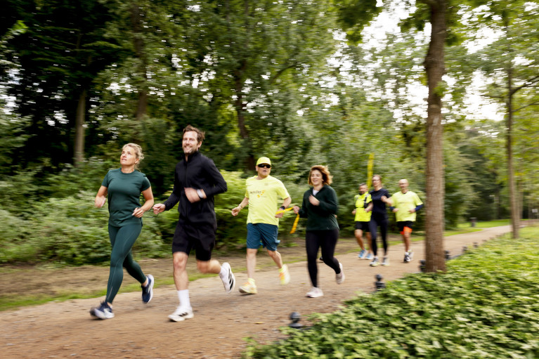 Group of people running in a park
